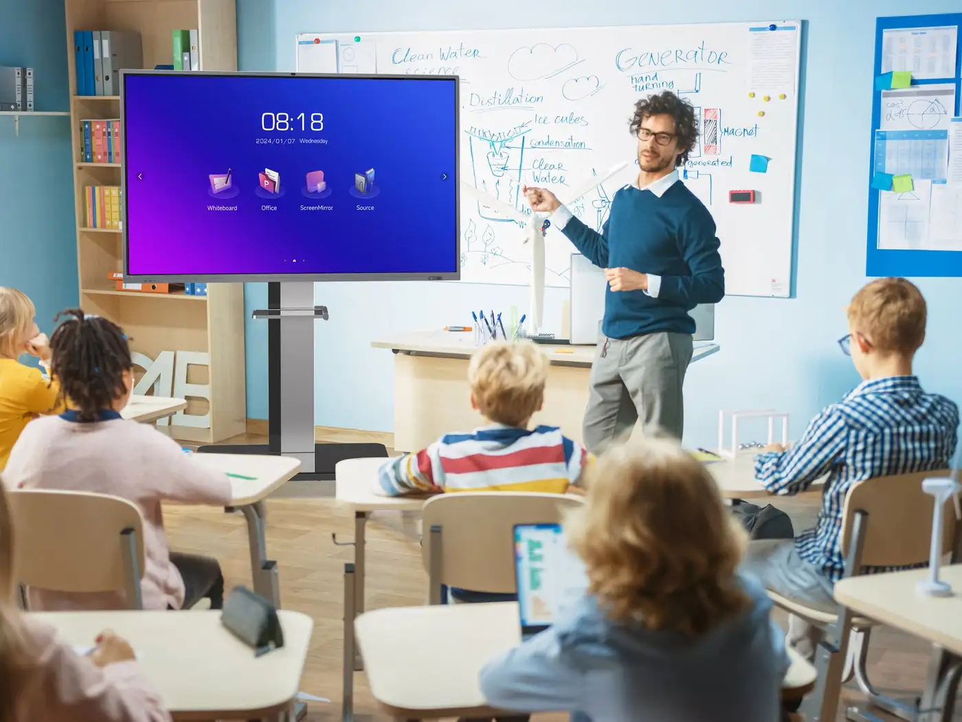 A teacher giving a lesson on a Horion interactive panel in a spacious classroom, students at desks